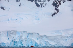 ‘Ginormous’ Glaciers: It would be easy to miss the Zodiac carrying about a dozen guests from Seabourn Quest. Spending an afternoon on Zodiac tours in the Lemaire Channel, guests marvel at glaciers and the sheer immensity of Antarctica. © 2014 Avid Travel Media Inc.