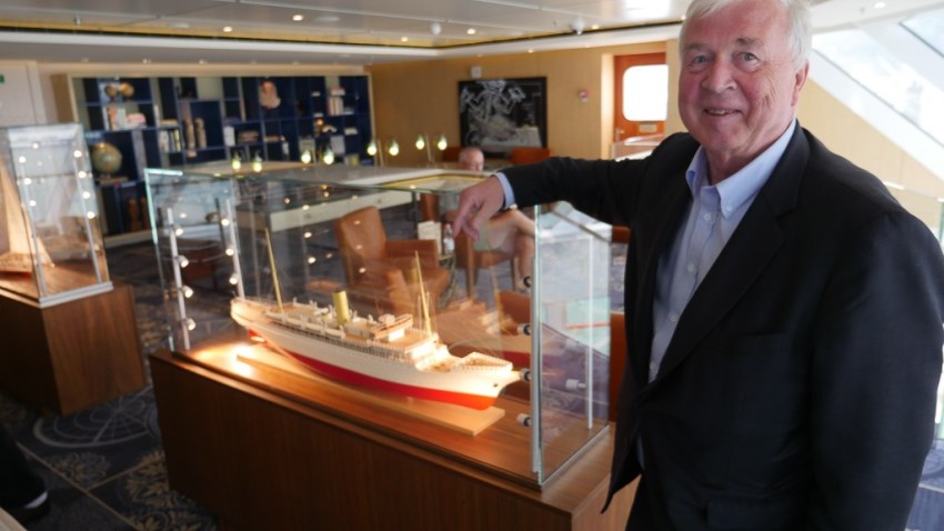 On Viking Star Torstein Hagen stands beside a model from the fleet of Bergen Line, where he began his career in the 1970s. © 2015 Ralph Grizzle