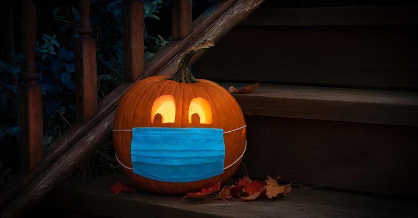 Lighted Halloween Pumpkin Jack o Lantern Wearing Covid PPE Mask On Steps