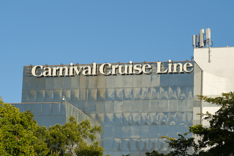 Miami, Florida, USA - January 1, 2022: Carnival Cruise Line logo sign on their headquarters building in Miami, Florida, USA. Carnival Cruise Line is an international cruise line.