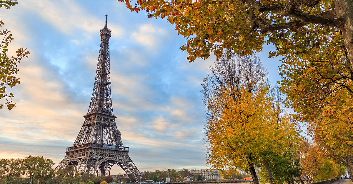 Eiffel tower in Paris France on an autumn day surrounded by tree